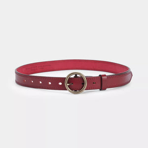 Red leather belt with antique brass round buckle and visible stitching.