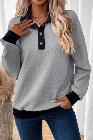 Gray diamond quilted polo sweatshirt with black collar, cuffs, and hem.