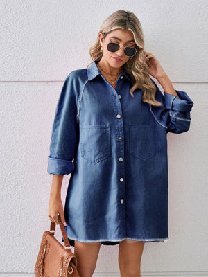 Dark blue denim shirt dress with raw hem, button front, and chest pockets.