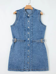 Belted denim dress with button front, mandarin collar, sleeveless, and silver buckle detail.