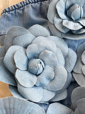 Blue denim strapless dress with 3D floral applique details.