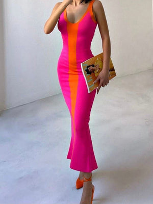 Contrast panel bodycon maxi dress in pink and orange with a flared hem.