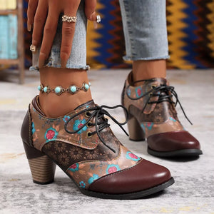 Floral patchwork lace-up ankle boots in dark brown with a block heel.