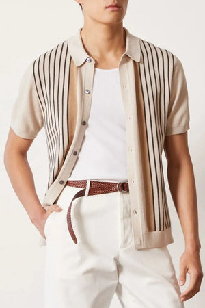 Beige knit polo shirt with vertical stripes and buttoned front.