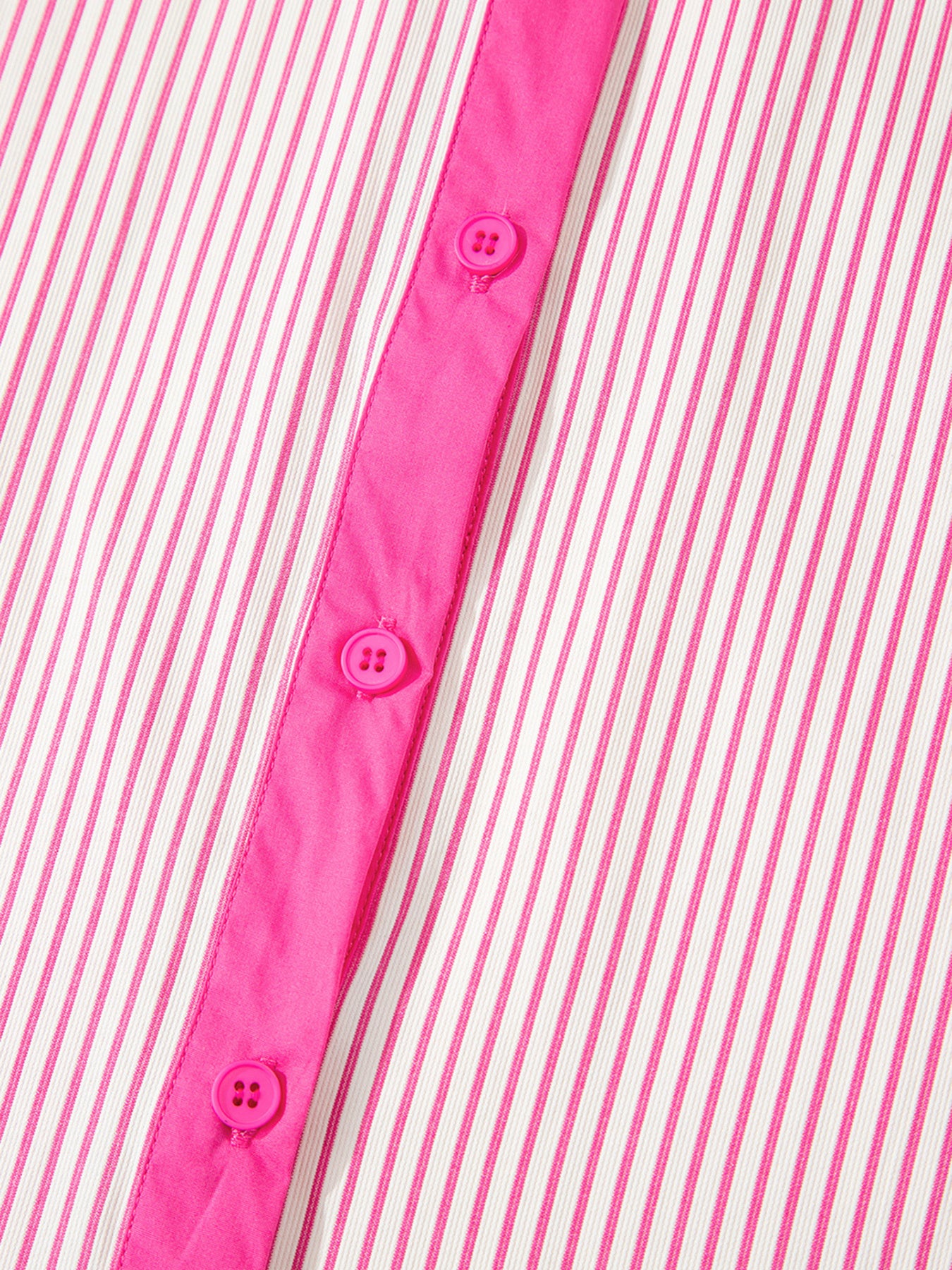 Button-down mini dress with pink and white stripes and a bright pink placket and buttons.