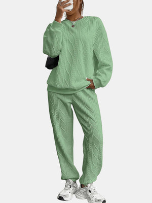 Cable knit loungewear set in Gum Leaf green featuring a crewneck sweatshirt and relaxed fit pants.