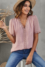 Dusty pink dotted swiss blouse with lace trim V-neck and short sleeves