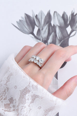 Cascading cluster diamond ring in silver sterling silver with multiple sparkling stones.