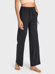 Black wide-leg lounge joggers with utility pockets and drawstring waist