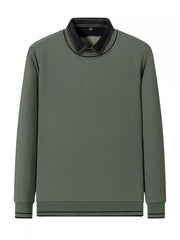 Sage ribbed knit sweater with a black collar and contrast stitching.
