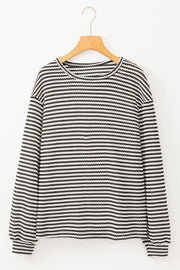 Textured stripe balloon sleeve top in black and white with a crew neck.