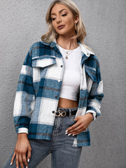 Azure plaid oversized button-up shirt with chest pockets and a relaxed fit.