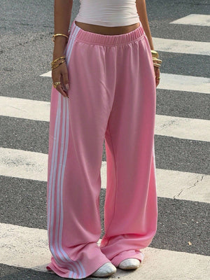 Pink sweatpants with white side stripes and elasticated waist.