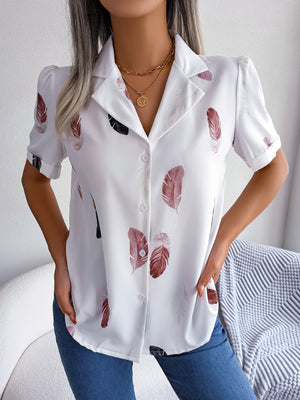 White feather print collared puff sleeve blouse with button front.