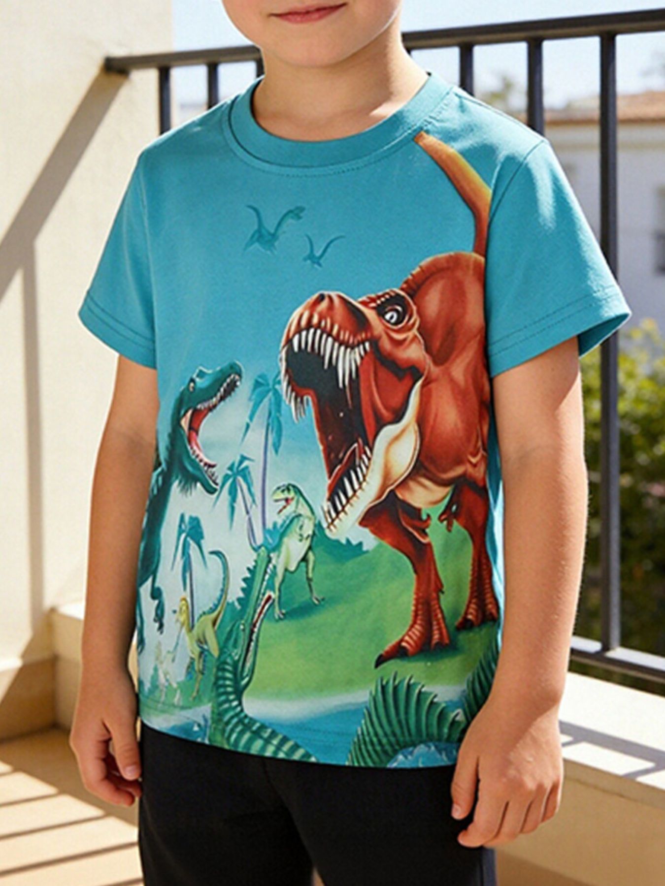 Toddler t-shirt in blue with a colorful dinosaur adventure graphic, crewneck, short sleeves.