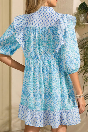 Blue patchwork ruffle mini dress with balloon sleeves and tiered hem.
