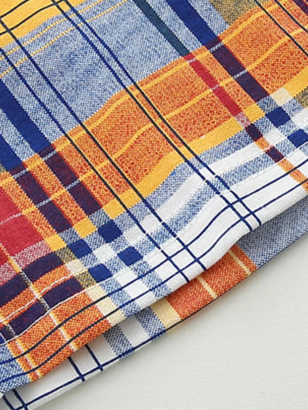 Boys' cotton plaid underwear set with orange, blue, yellow, and red plaid pattern.