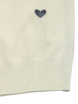 Cream acrylic sweater with scattered dark heart intarsia detail and ribbed hem.