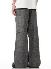 Grey wide-leg cargo pants with multiple pockets and a relaxed fit.
