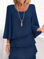 Dark blue tiered dress with 3/4 bell sleeves and scoop neckline.