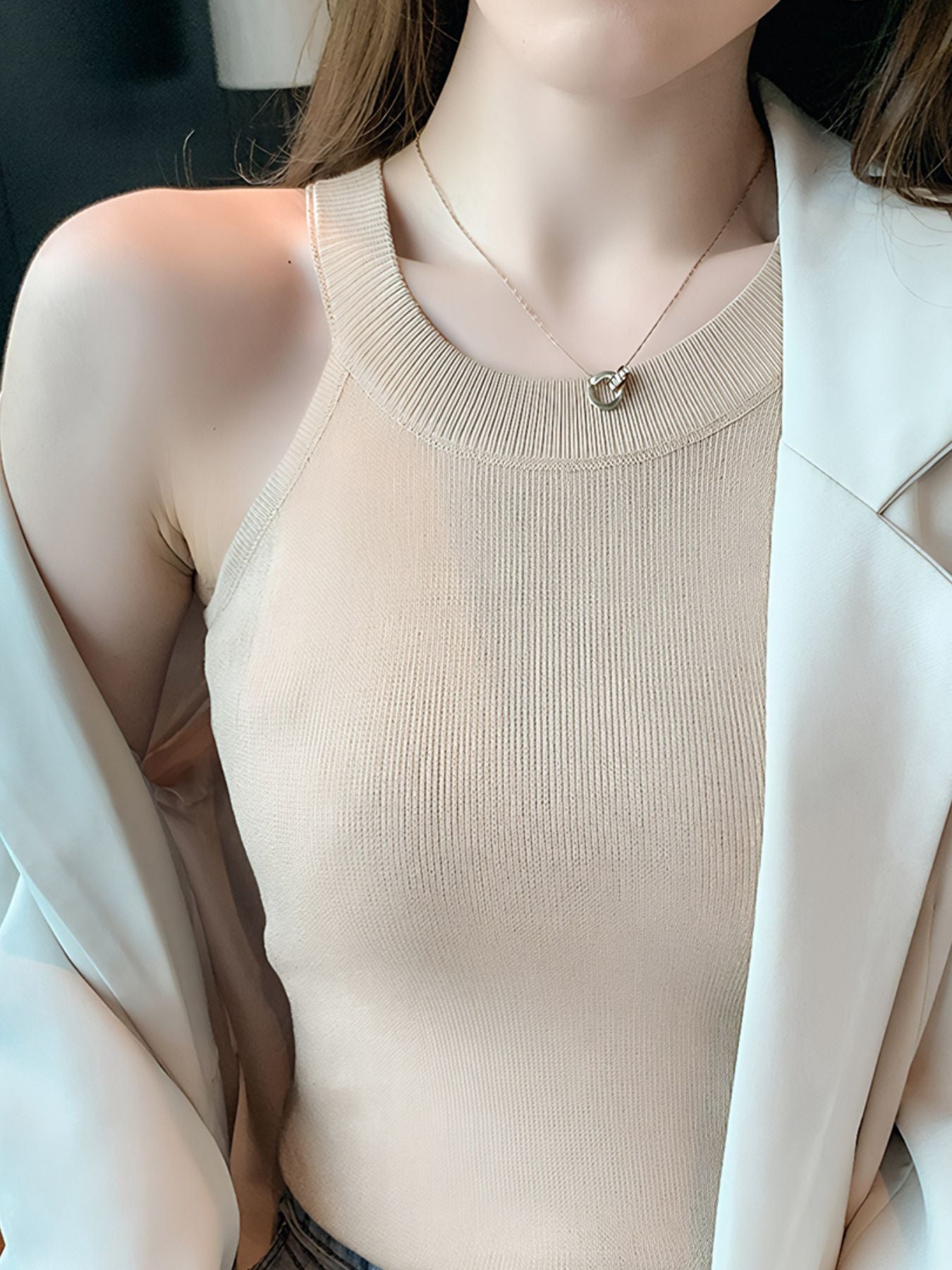 Apricot ribbed knit cami tank top with a crew neckline.