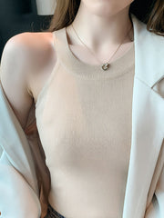 Apricot ribbed knit cami tank top with a crew neckline.
