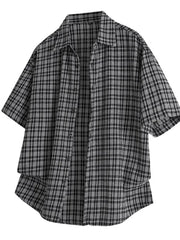 Black oversized plaid button-front shirt with short sleeves.