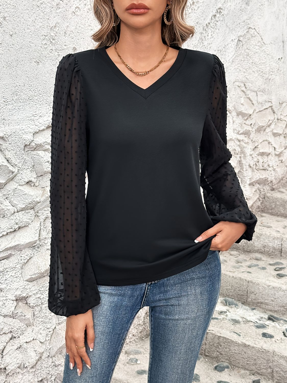 Black V-neck blouse with sheer dot puff sleeves