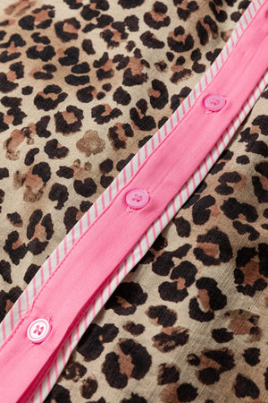 Print short sleeve shirt with leopard pattern and pink button placket detail.