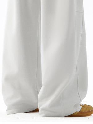 Men's white casual drawstring joggers with side pockets and a relaxed fit.