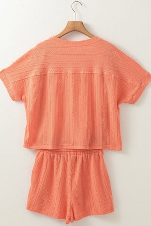 Textured knit drawstring short set in sherbet with short sleeves and elastic waist shorts.