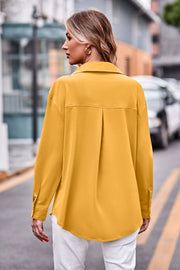 Oversized utility shirt in gold with a pleated back detail and button cuffs.