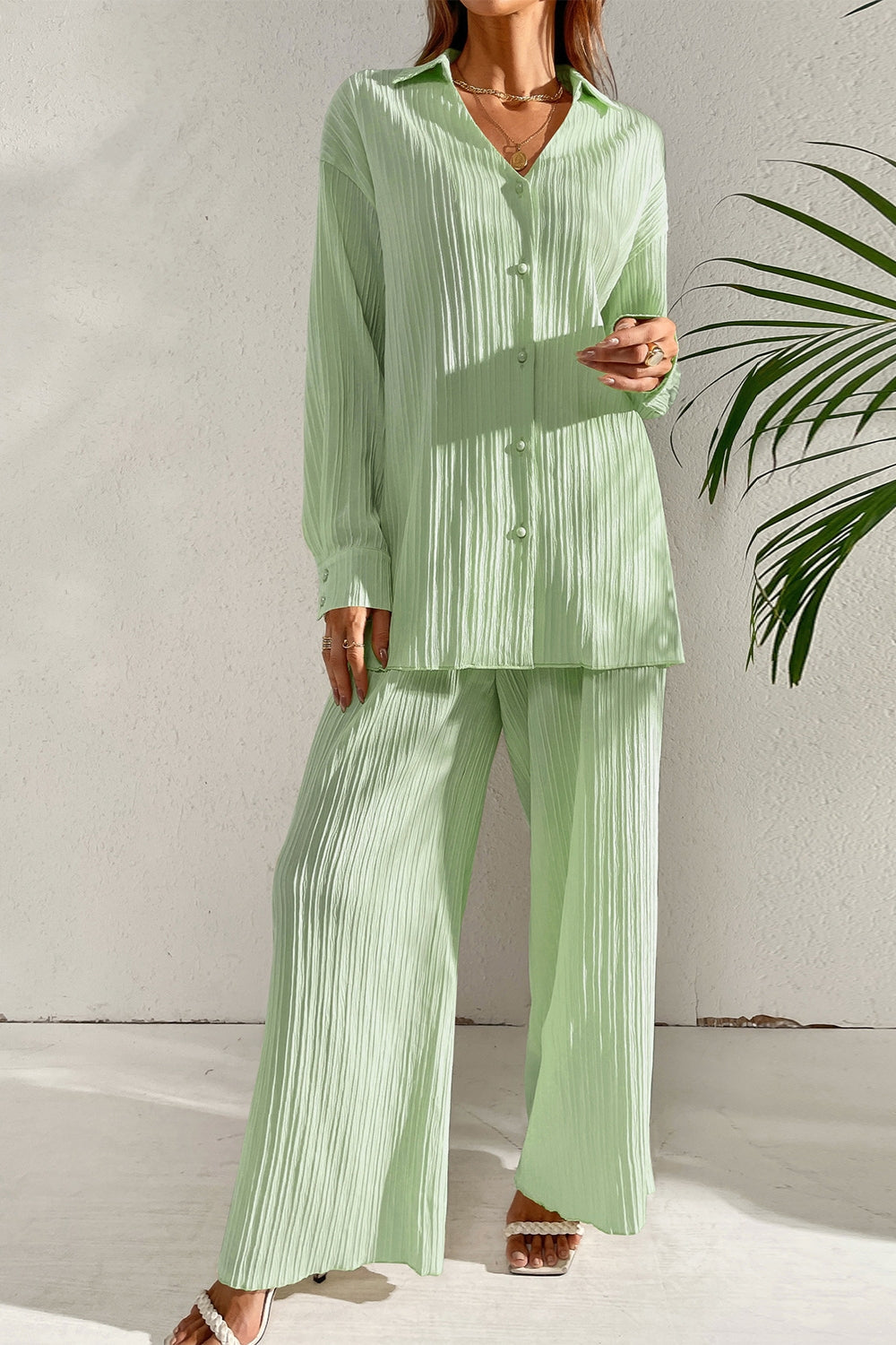 Pleated co-ord set in pastel blue with button-down shirt and wide leg trousers