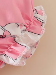 Pink baby dress with bunny print and ruffled trim.