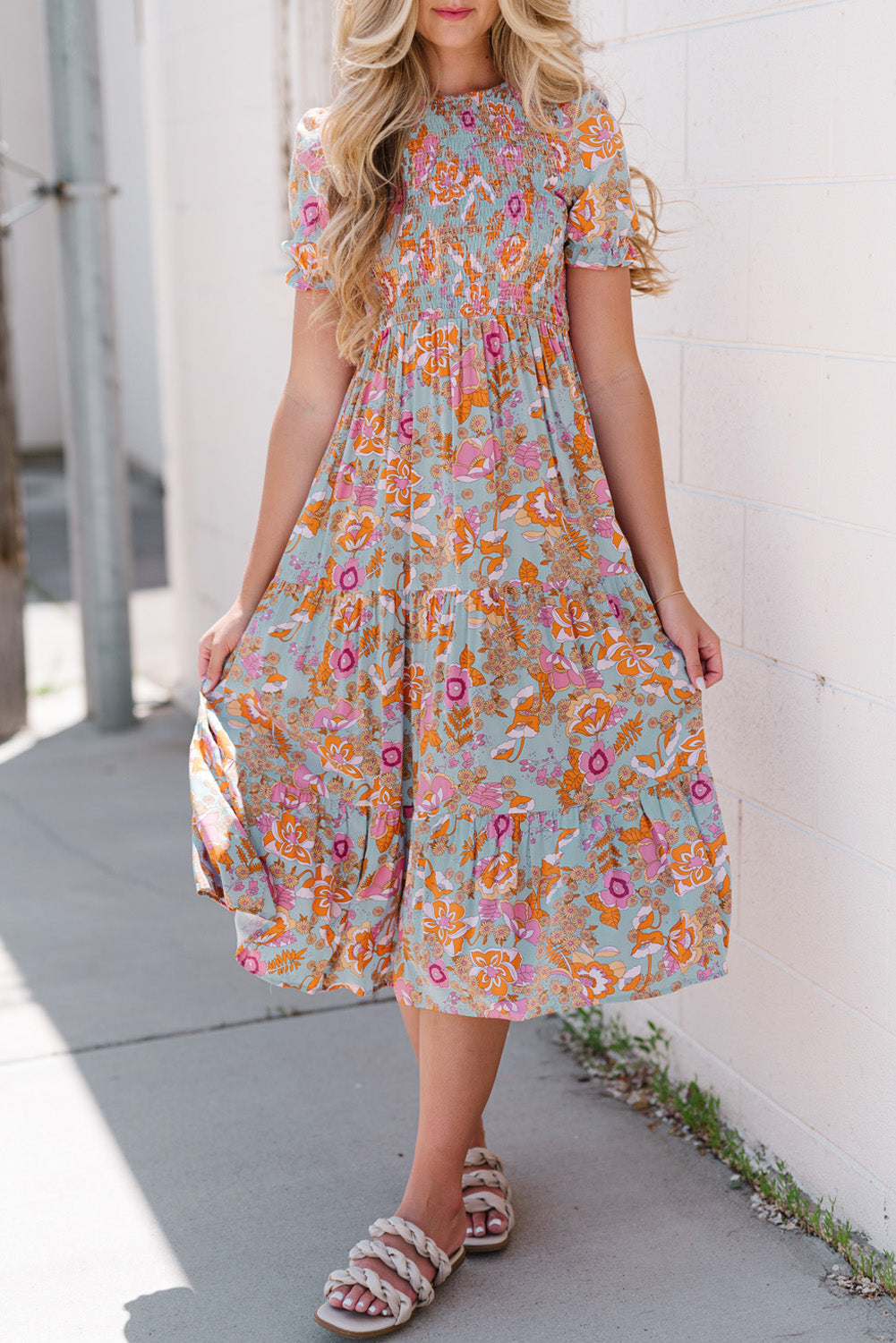 Floral smocked bodice tiered midi dress with short sleeves and a-line cut.