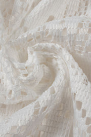 White lace peplum blouse with scalloped hem detail and breathable fabric.