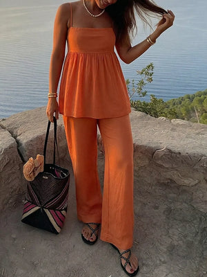 Orange square neck cami and wide-leg pants set with spaghetti straps and smocked waist detail.