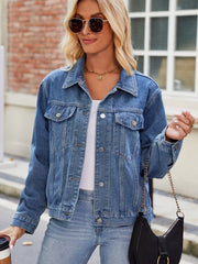 Faded denim boxy fit jacket with button closure and chest pockets.