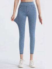 Light wash denim illusion leggings with a sculpted fit and faux pockets.