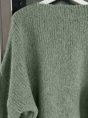 Moss green knit cardigan with balloon sleeves and ribbed neckline.
