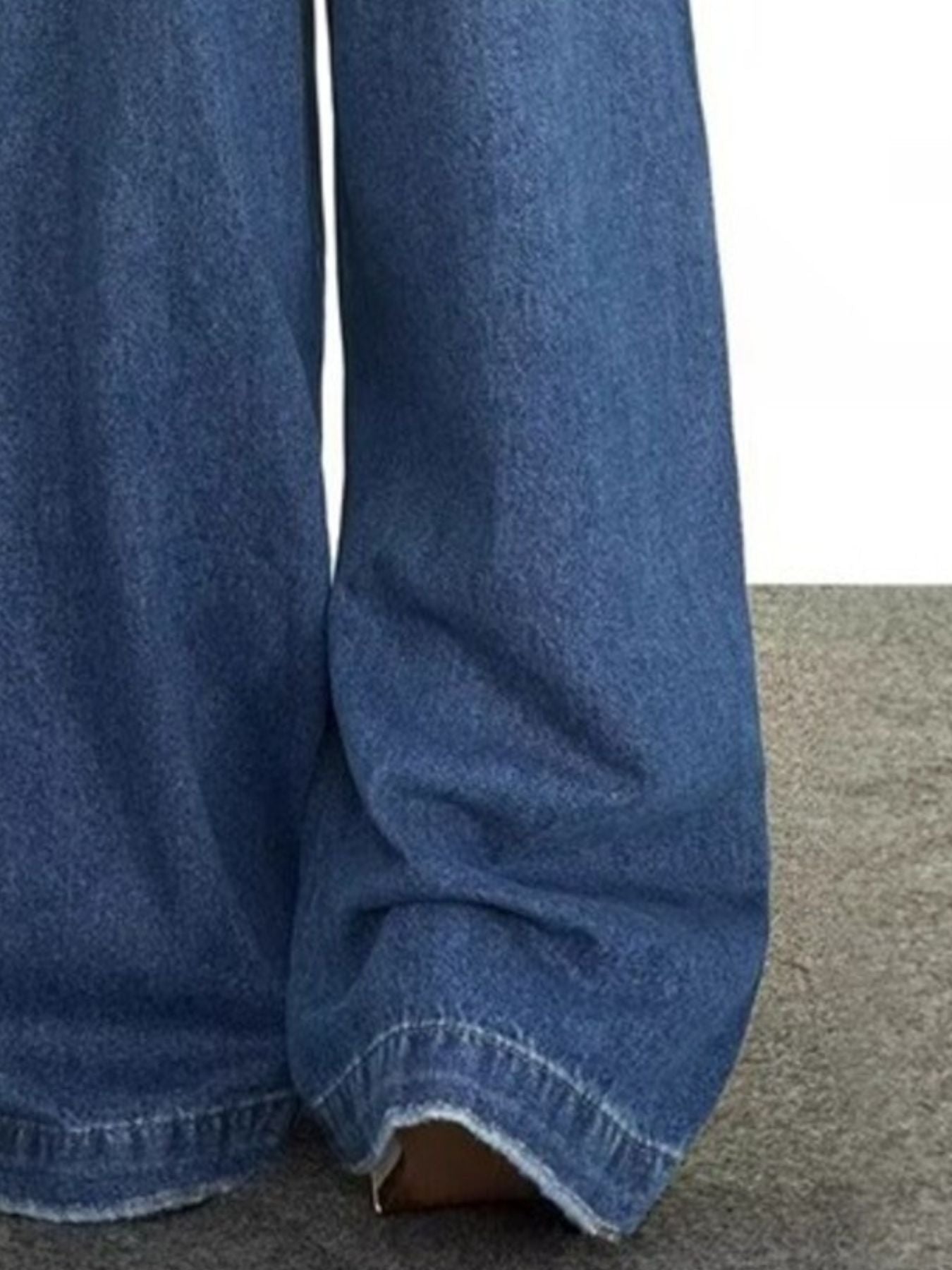 Men's blue wide leg denim jeans with classic fit and comfortable cotton blend material.