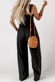 Black smocked crop top and wide leg lounge pants set with spaghetti straps.