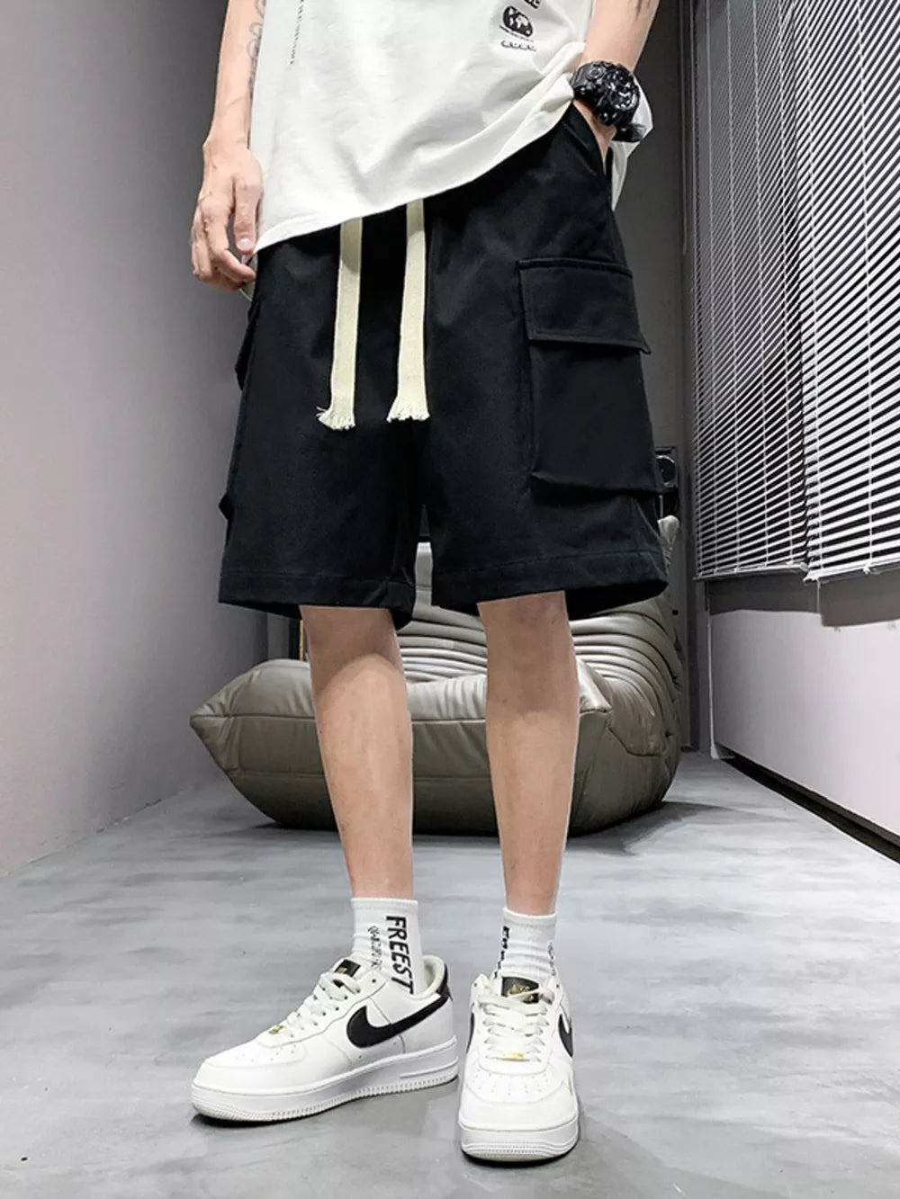 Black relaxed fit cargo shorts with drawstring and multiple pockets