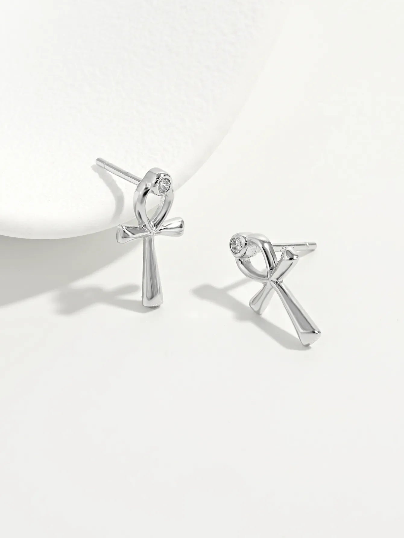 Silver ankh stud earrings with zircon detail