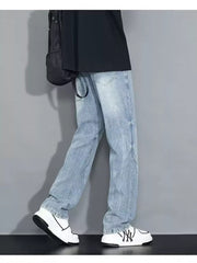 Men's light wash loose-fit jeans with a faded look and distressed details.