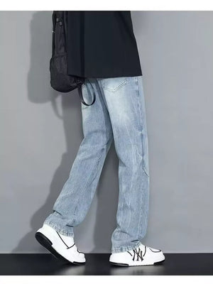 Men's light wash loose-fit jeans with a faded look and distressed details.
