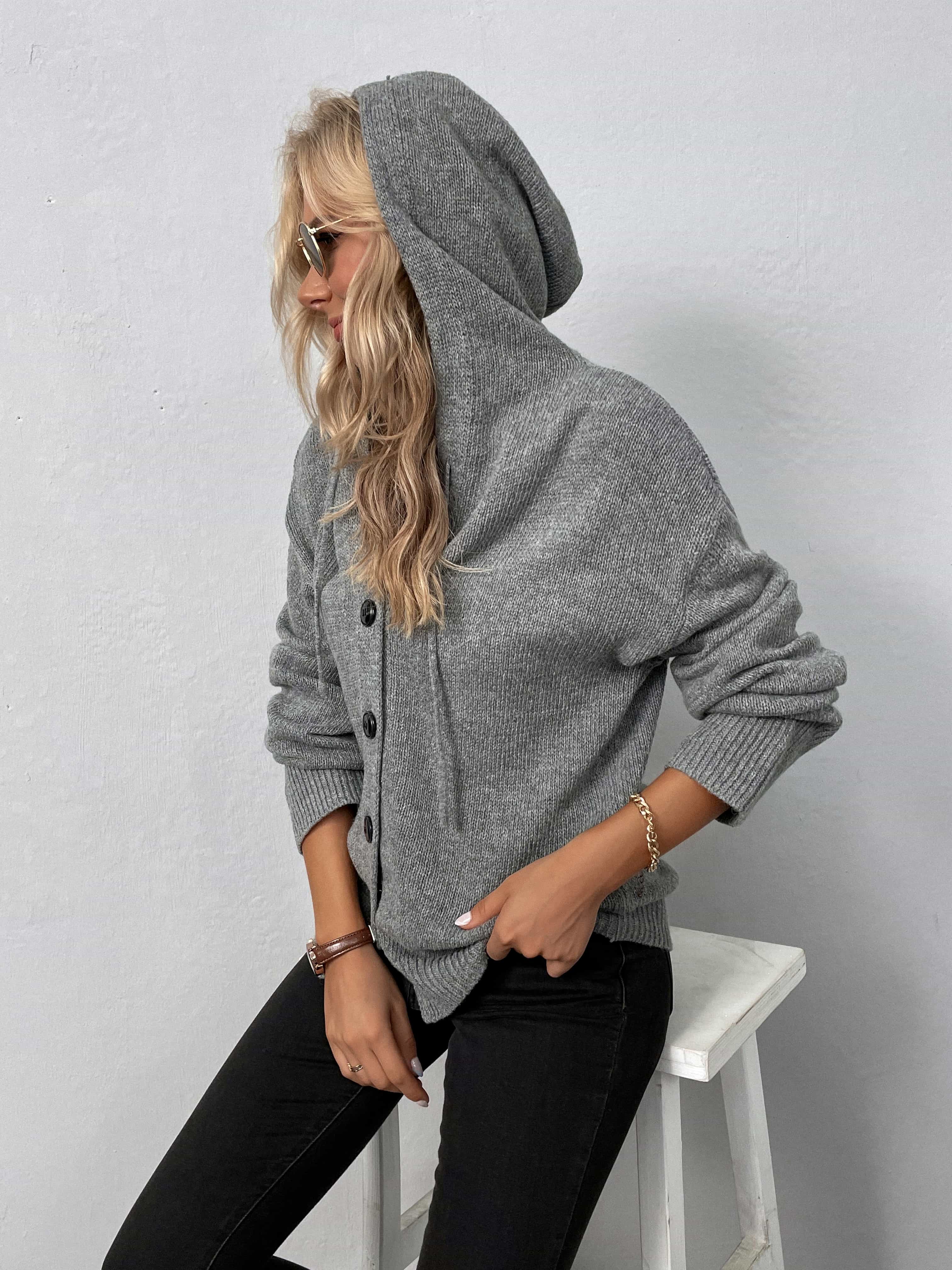 Gray button-front hooded knit cardigan with ribbed cuffs and hem.