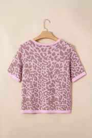 Pink leopard print knit cardigan with short sleeves and crew neck.
