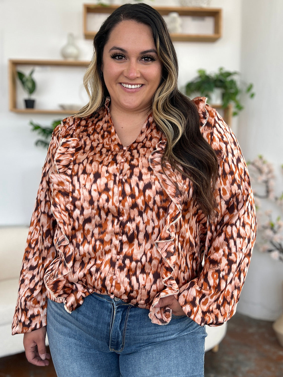 Caramel animal print ruffle front blouse with buttoned placket and V-neck