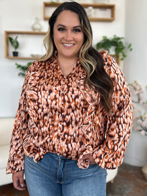 Caramel animal print ruffle front blouse with buttoned placket and V-neck